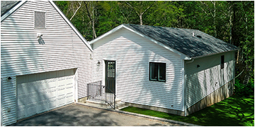 Small dwelling connected to a garage.